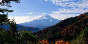 A breathtaking view of Mount Fuji surrounded by vibrant autumn foliage, showcasing the beauty of nature in fall