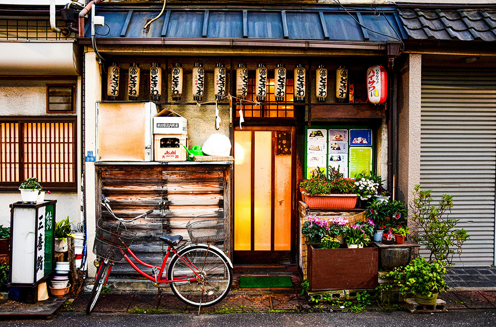 A bicycle is parked outside a store, showcasing a quaint scene in front of a Japan House