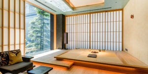 Modern Japanese tatami room with shoji screens and minimalist design.